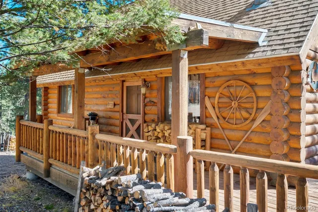 a view of a porch with wooden fence