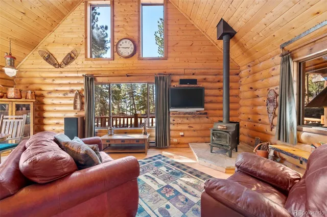 a bedroom with furniture and a flat screen tv