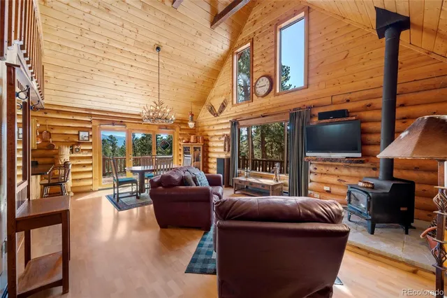a outdoor living space with patio furniture and a flat screen tv