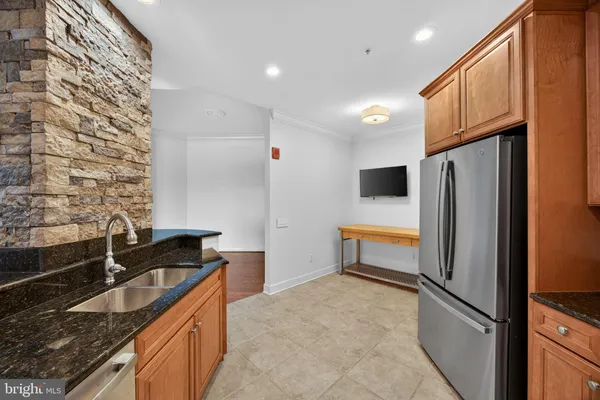 a kitchen that has a sink and a stove in it