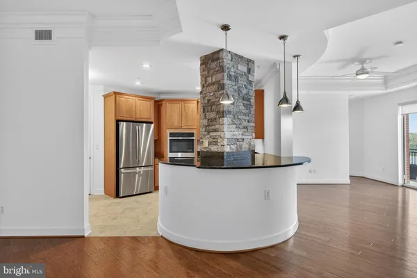a kitchen with granite countertop a sink and a stove