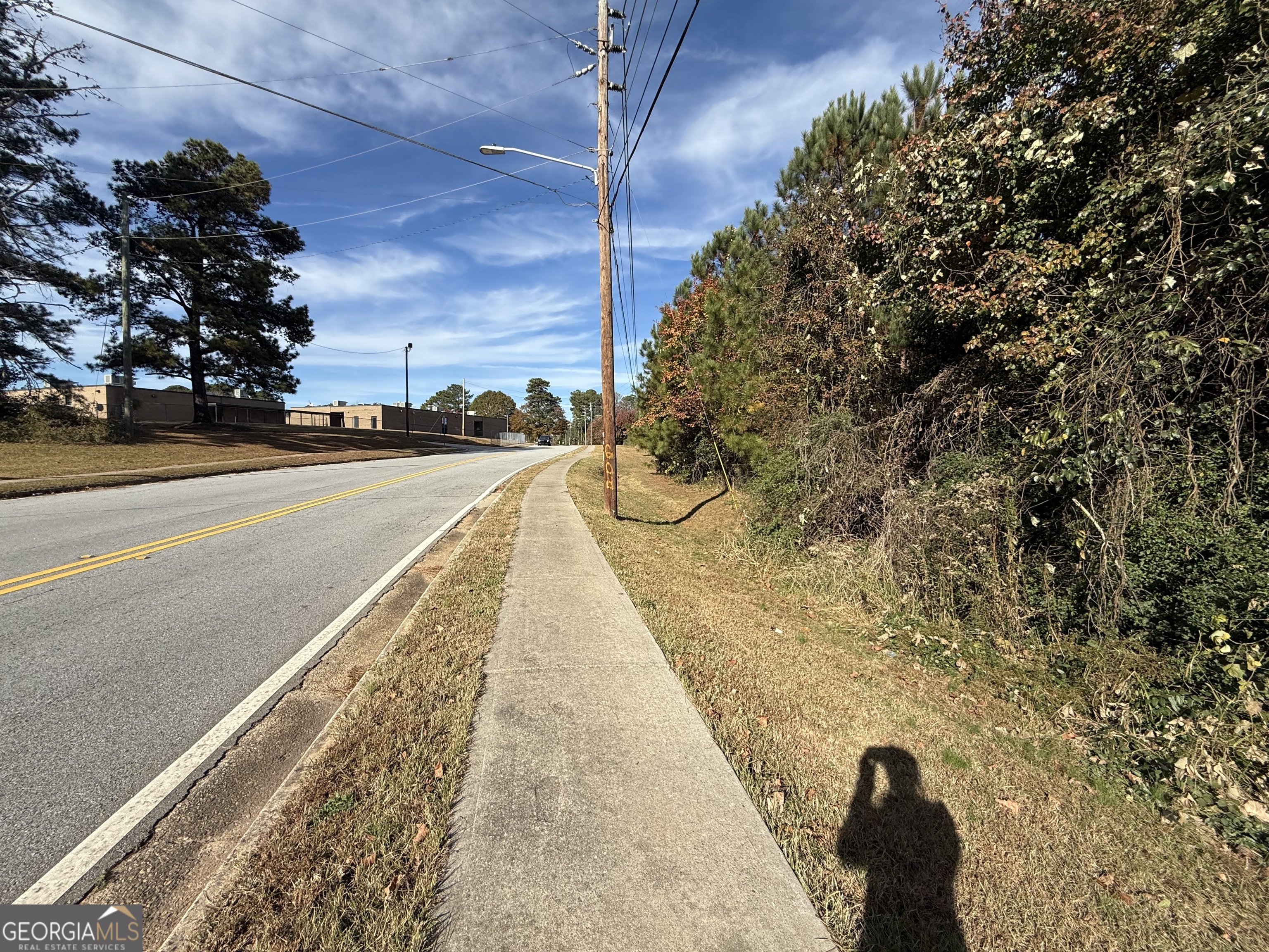 8640 Webb Road Riverdale, GA 30274 - Photo 2 of 6 a view of a swimming pool with a yard