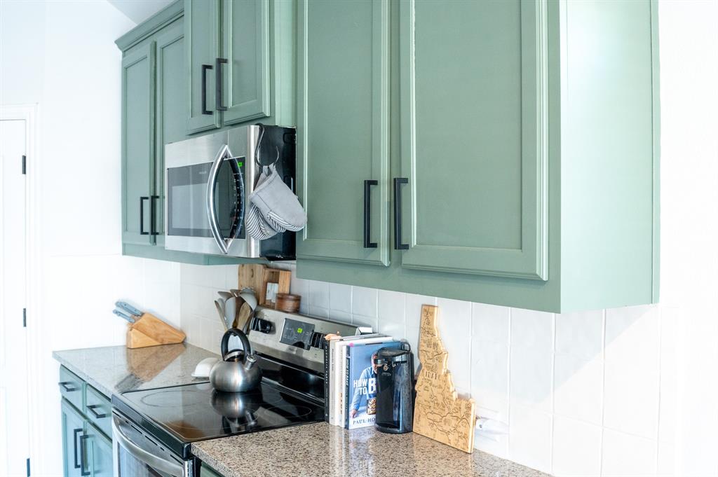 416 Windy Knoll Road Fort Worth, TX 76028 - Photo 11 of 34 a kitchen with a sink and cabinets