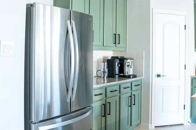 a kitchen with appliances and cabinets