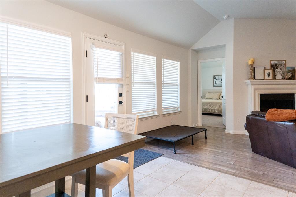 416 Windy Knoll Road Fort Worth, TX 76028 - Photo 15 of 34 a living room with furniture and a fireplace