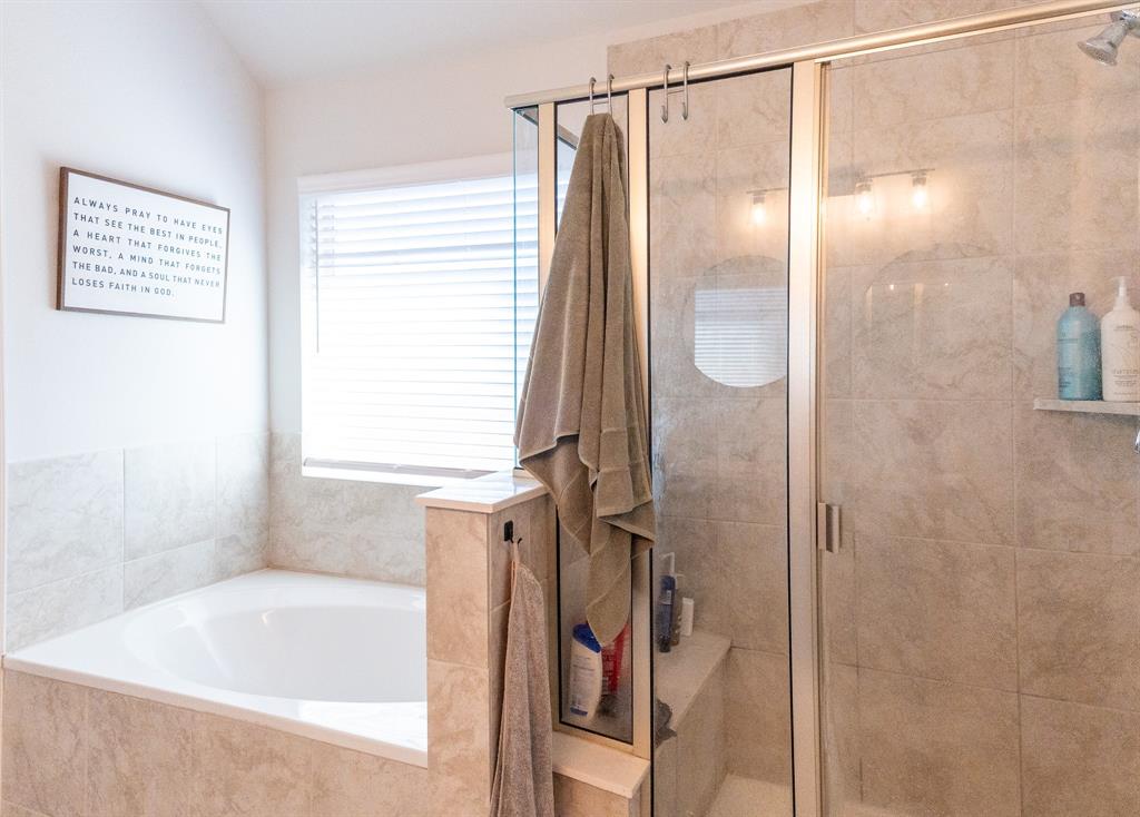 416 Windy Knoll Road Fort Worth, TX 76028 - Photo 22 of 34 a bathroom with a shower and a tub
