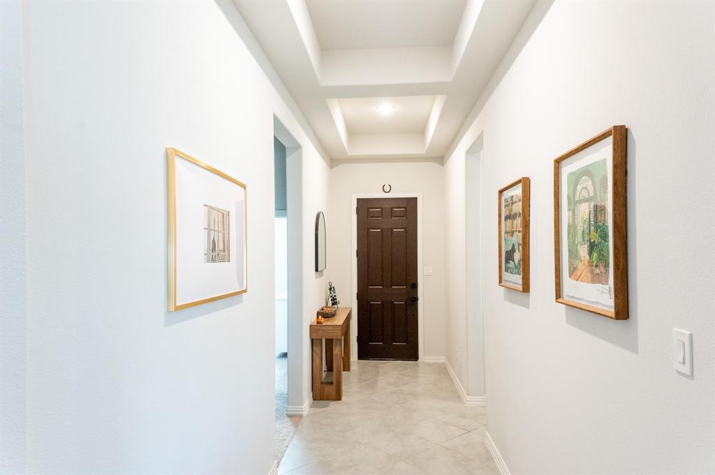 416 Windy Knoll Road Fort Worth, TX 76028 - Photo 24 of 34 a view of a hallway with windows and bathroom