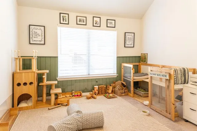 a bedroom with furniture and a window