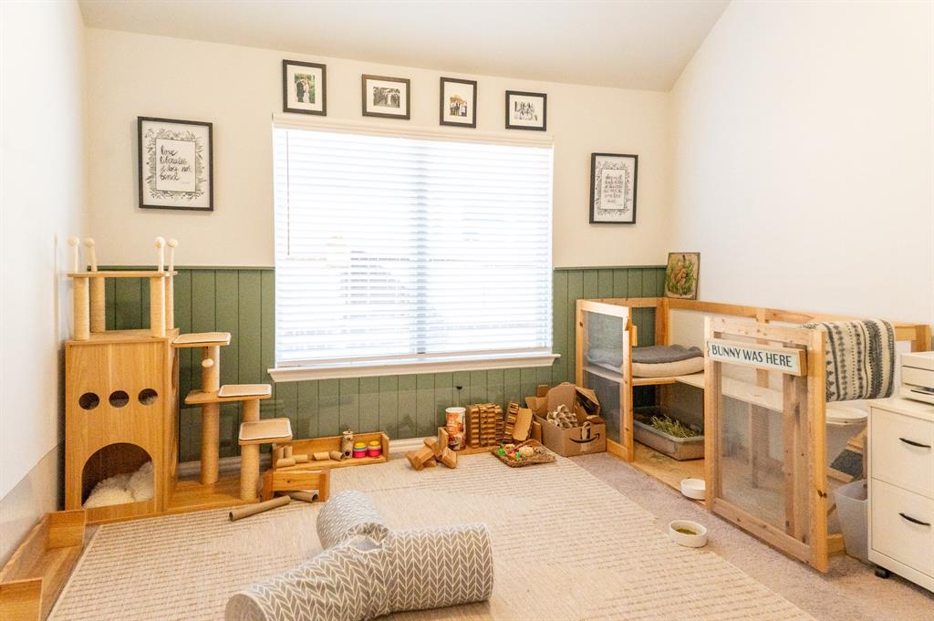 416 Windy Knoll Road Fort Worth, TX 76028 - Photo 25 of 34 a bedroom with furniture and a window