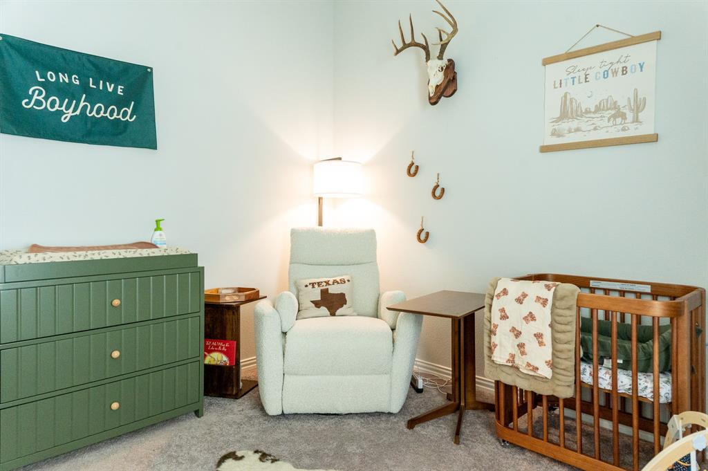 416 Windy Knoll Road Fort Worth, TX 76028 - Photo 27 of 34 a bedroom with a bed and a painting on the wall