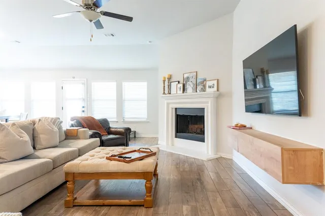 a living room with furniture and a fireplace