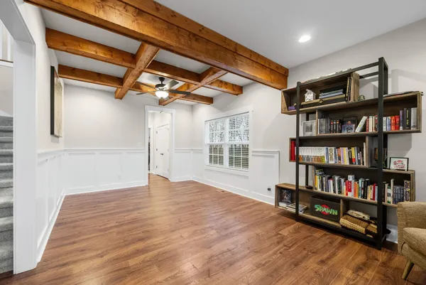 a view of a livingroom with furniture and a ceiling fan