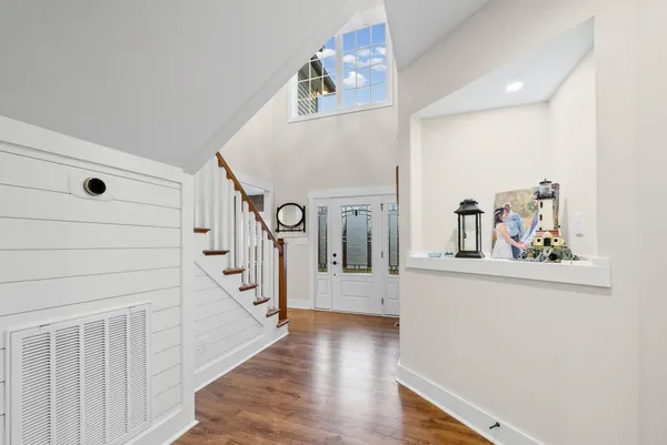 a view of entryway with wooden floor