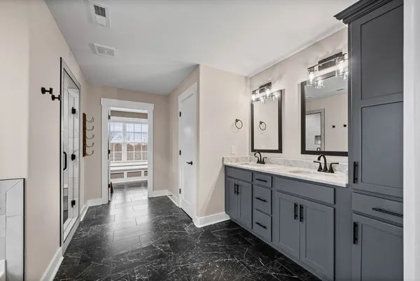 a bathroom with a bathtub and a shower