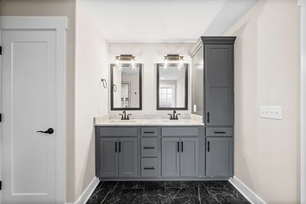 a bathroom with a walk in closet and a window