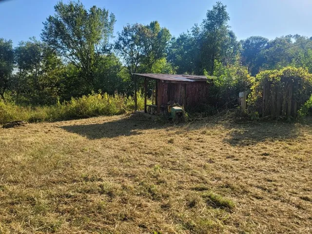 a backyard of a house with lots of green space
