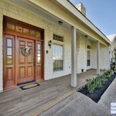 a front view of a house with garden