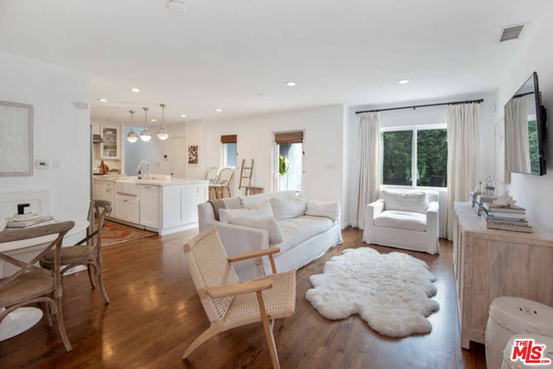 426 Venice Way Venice, CA 90291 - Photo 1 of 21 a living room with furniture and a large window