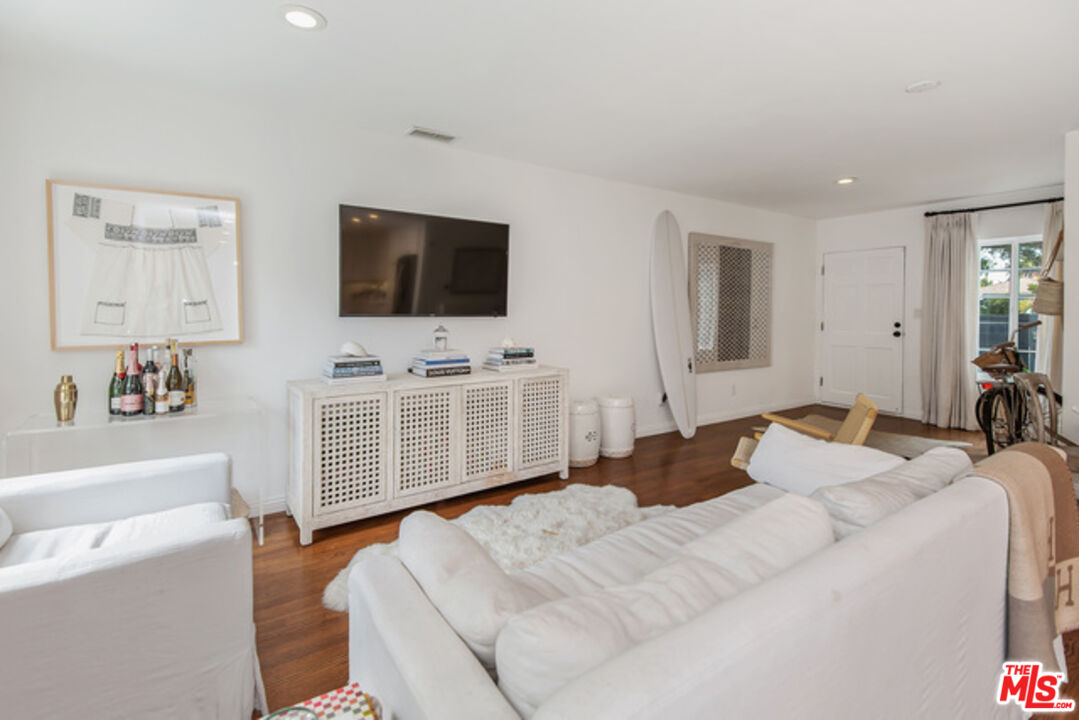 426 Venice Way Venice, CA 90291 - Photo 4 of 21 a bedroom with a bed and a flat screen tv