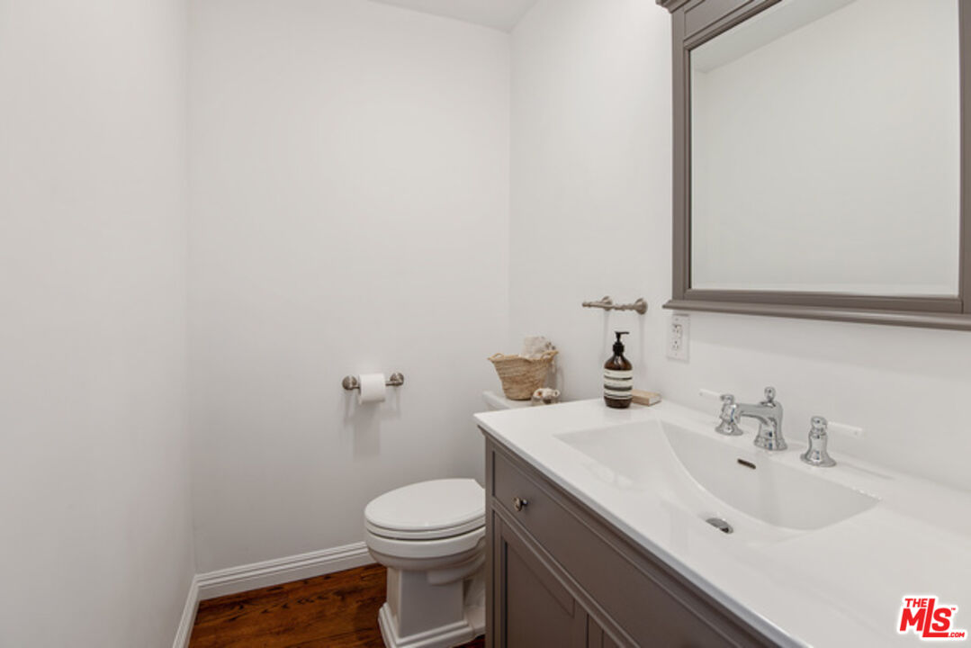 426 Venice Way Venice, CA 90291 - Photo 10 of 21 a bathroom with a sink a toilet and mirror