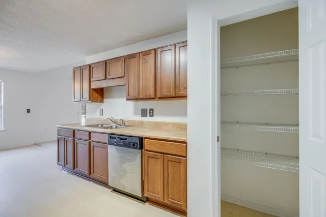 a kitchen with a sink and cabinets