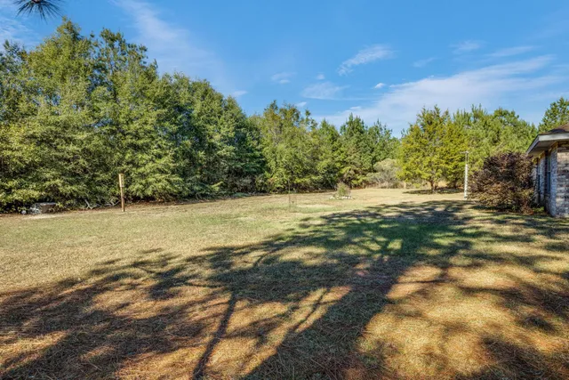 a view of yard covered with snow