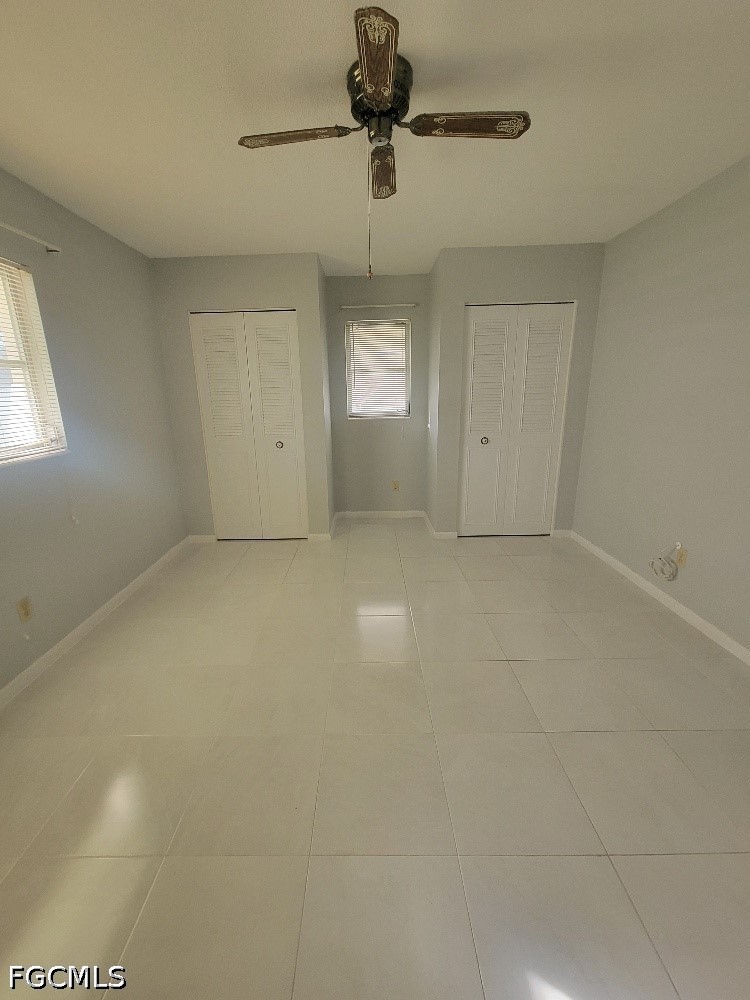 347 Richland Road Lehigh Acres, FL 33936 - Photo 11 of 16 a view of an empty room with a window