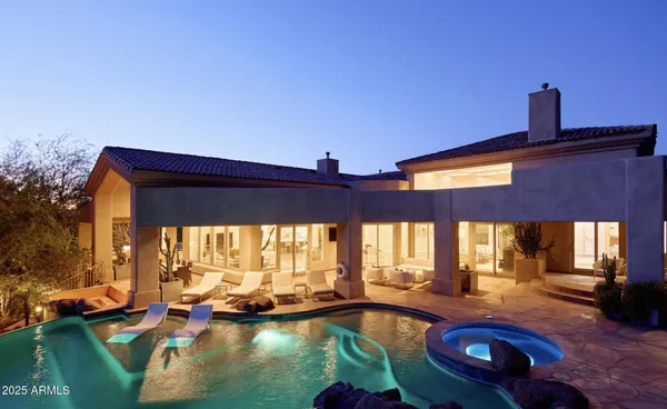 a view of folding clothes and a car parked in a yard