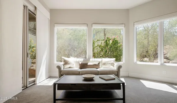 a kitchen with stainless steel appliances a sink a stove a microwave a sink and cabinets