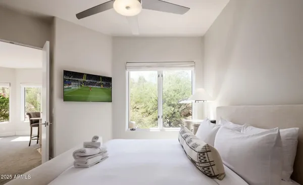 a living room with furniture and a large window