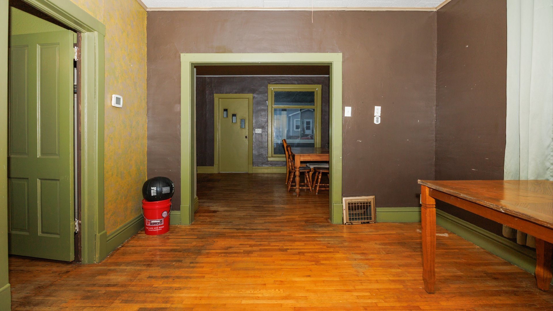 517 North Walnut Street Clinton, IL 61727 - Photo 14 of 29 a room with wooden floor and furniture