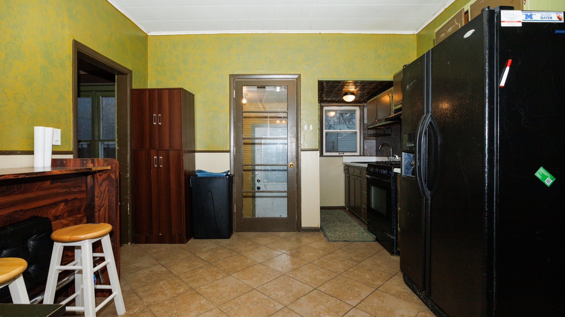 517 North Walnut Street Clinton, IL 61727 - Photo 17 of 29 a kitchen with stainless steel appliances kitchen island granite countertop a refrigerator and a sink