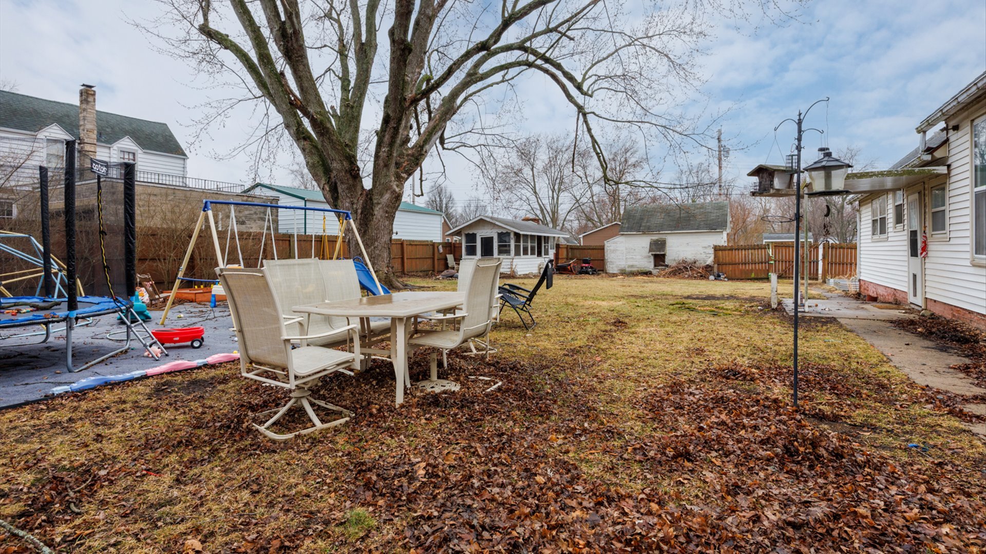 517 North Walnut Street Clinton, IL 61727 - Photo 25 of 29 a view of a house with backyard and sitting area