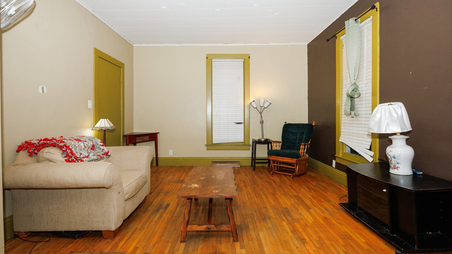 517 North Walnut Street Clinton, IL 61727 - Photo 4 of 29 a bedroom with a bed and wooden floor