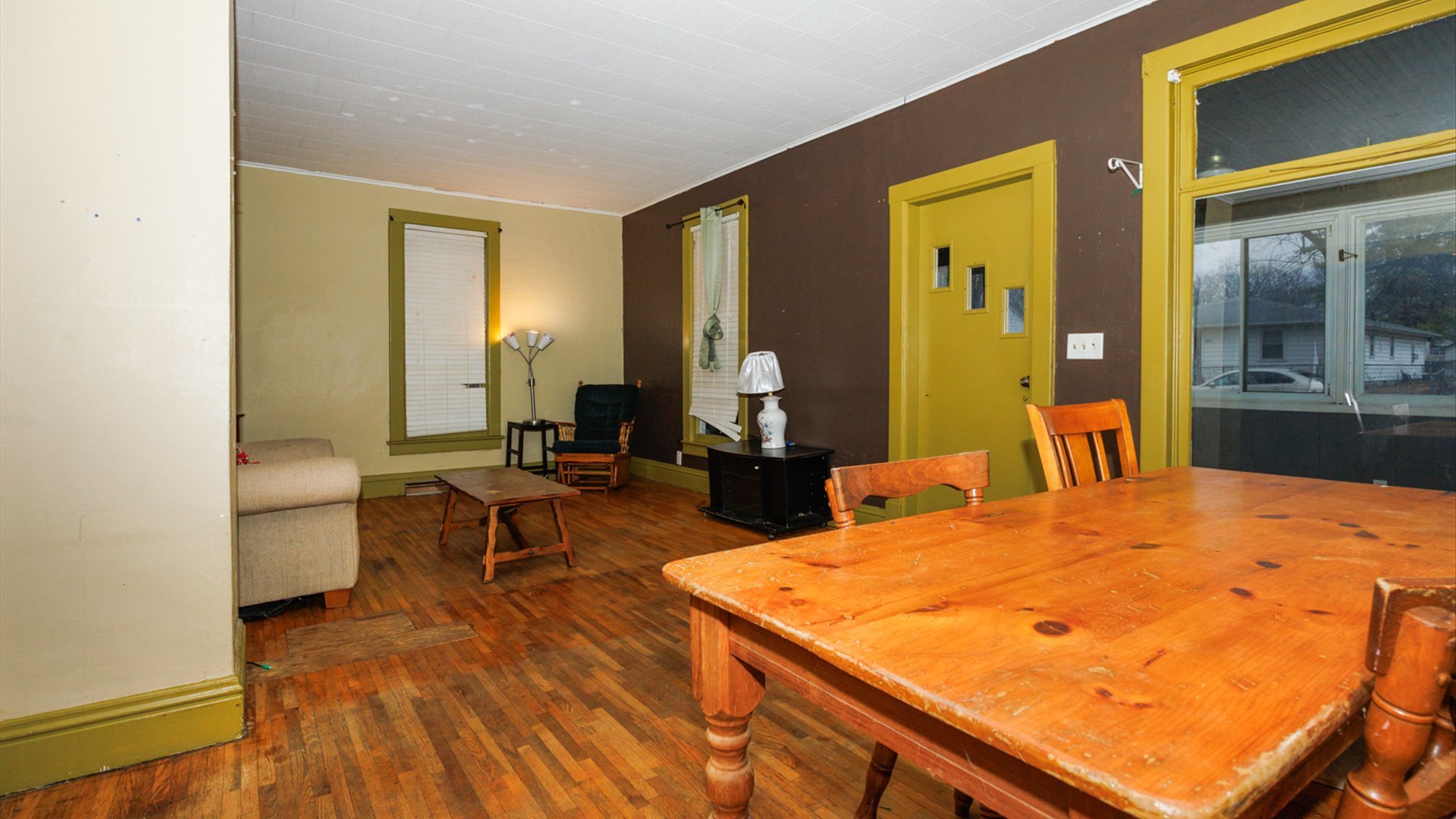 517 North Walnut Street Clinton, IL 61727 - Photo 8 of 29 a living room with dining table and wooden floor