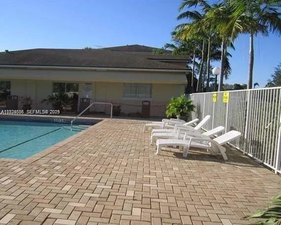 a view of house with patio outdoor seating