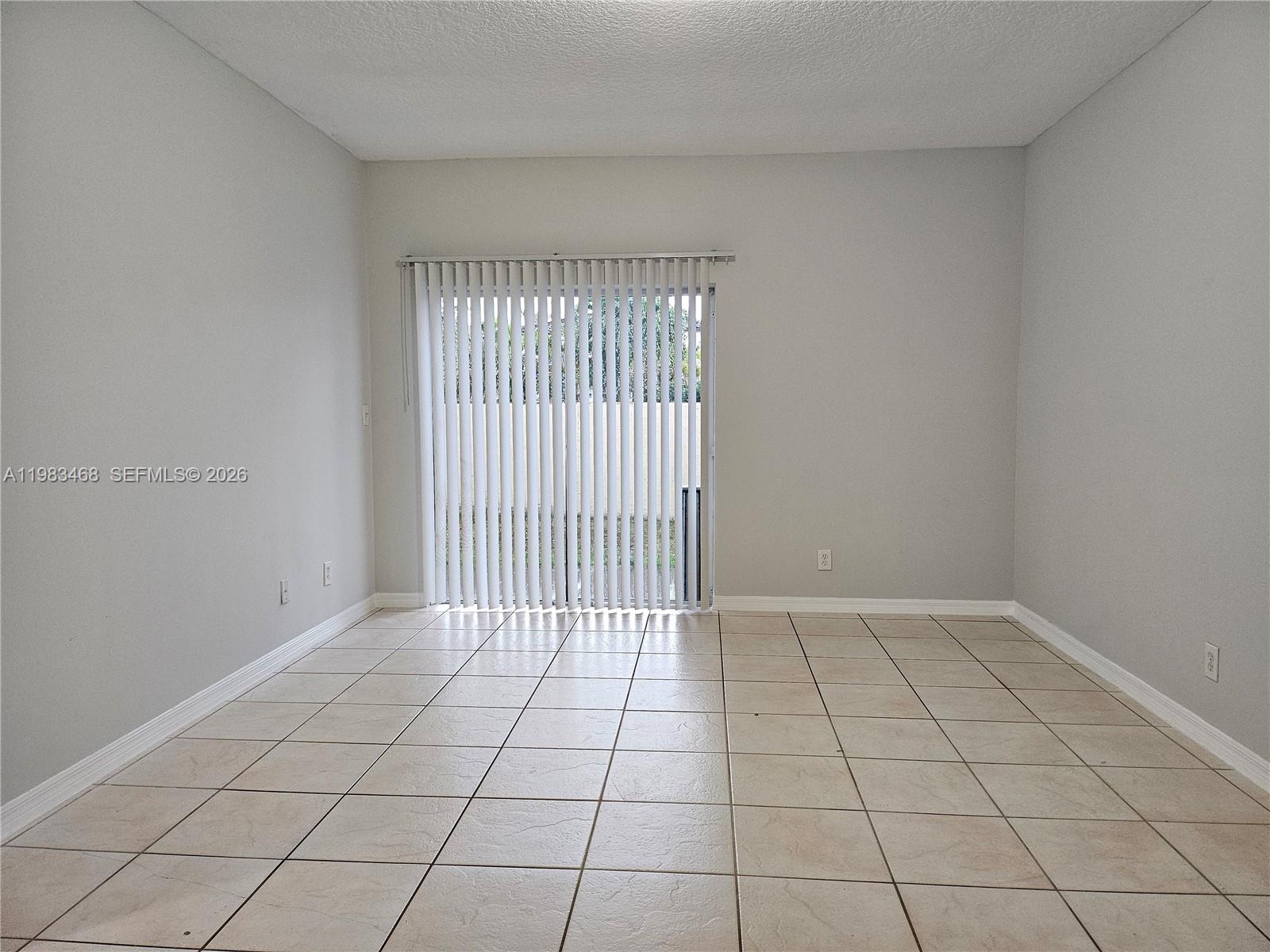 14924 Southwest 58th Street Miami, FL 33193 - Photo 15 of 17 a view of an empty room and window