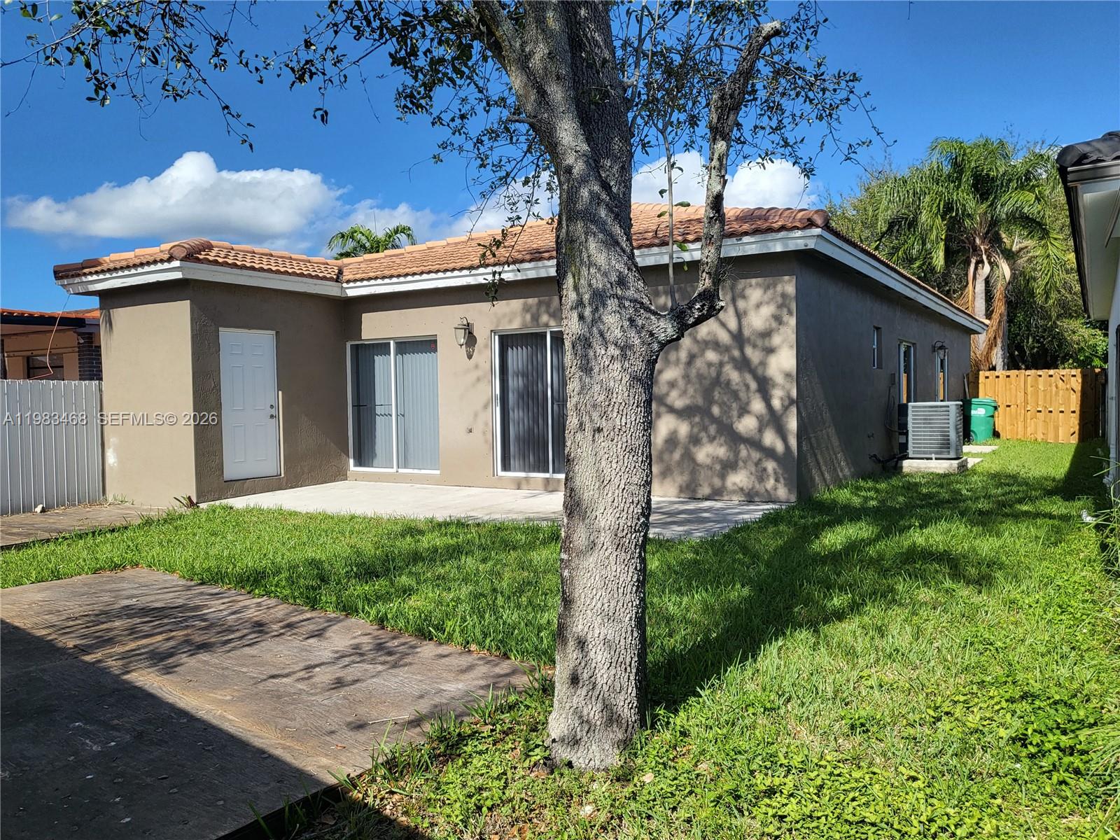 14924 Southwest 58th Street Miami, FL 33193 - Photo 3 of 17 a view of a house with a yard
