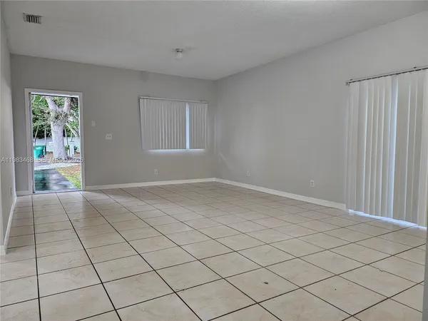 a view of an empty room and window