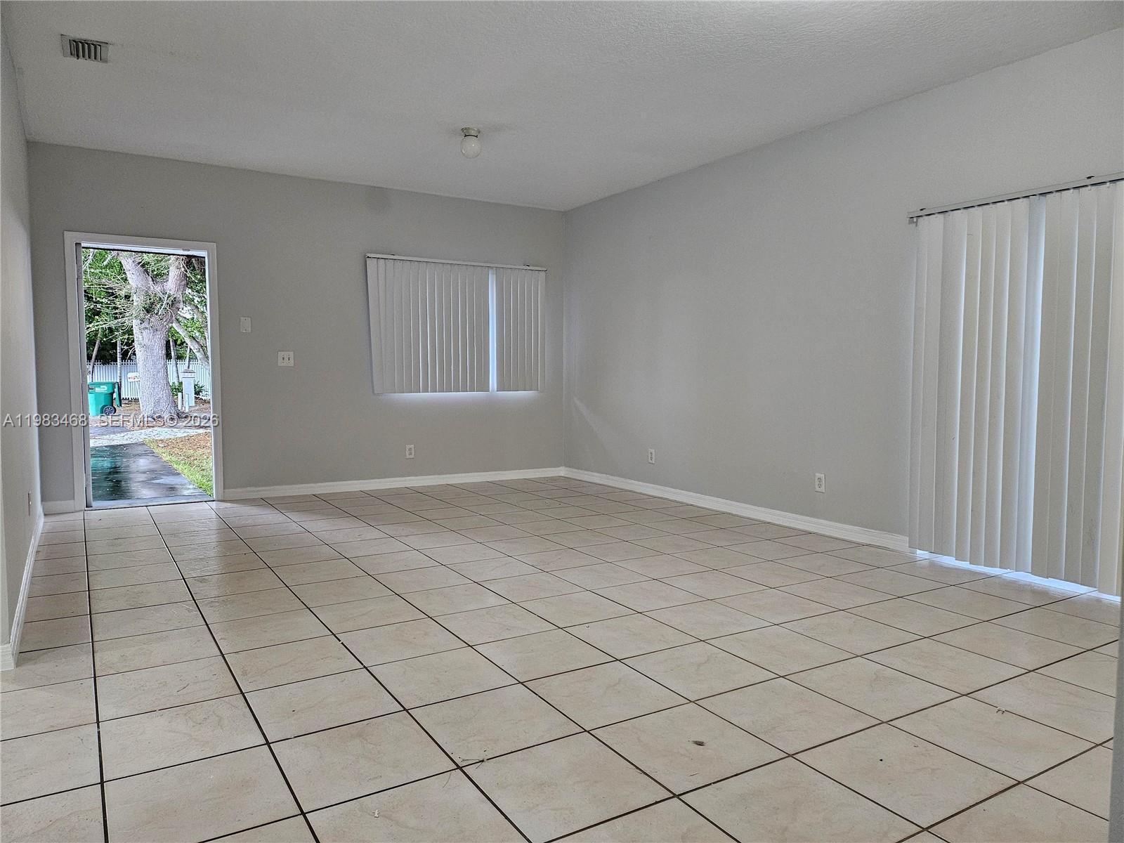 14924 Southwest 58th Street Miami, FL 33193 - Photo 7 of 17 a view of an empty room and window