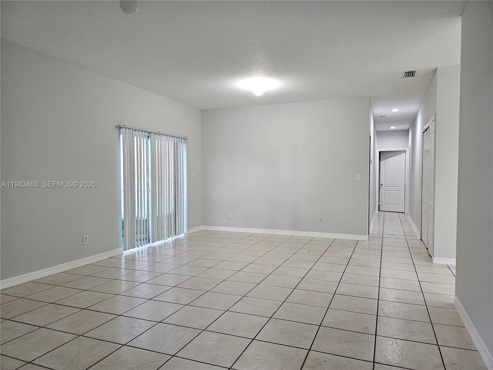 14924 Southwest 58th Street Miami, FL 33193 - Photo 8 of 17 a view of an empty room and window