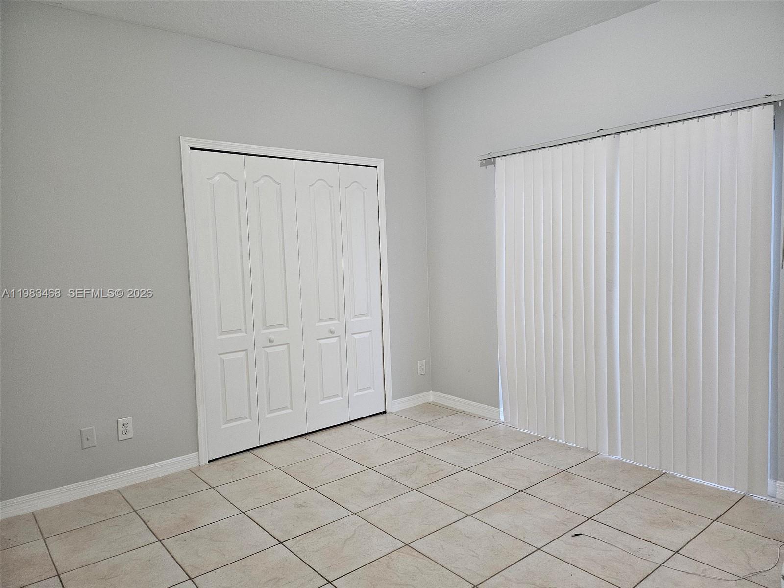14924 Southwest 58th Street Miami, FL 33193 - Photo 10 of 17 a view of an empty room