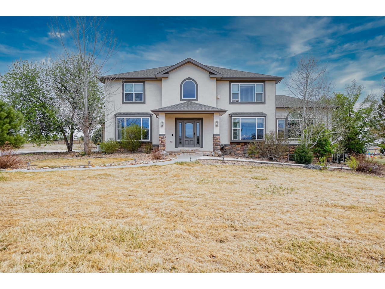 3938 Vale View Lane Mead, CO 80542 - Photo 1 of 49 a view of a house with a swimming pool