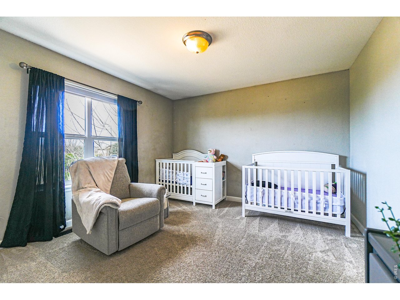 3938 Vale View Lane Mead, CO 80542 - Photo 26 of 49 a bedroom with furniture and a large window