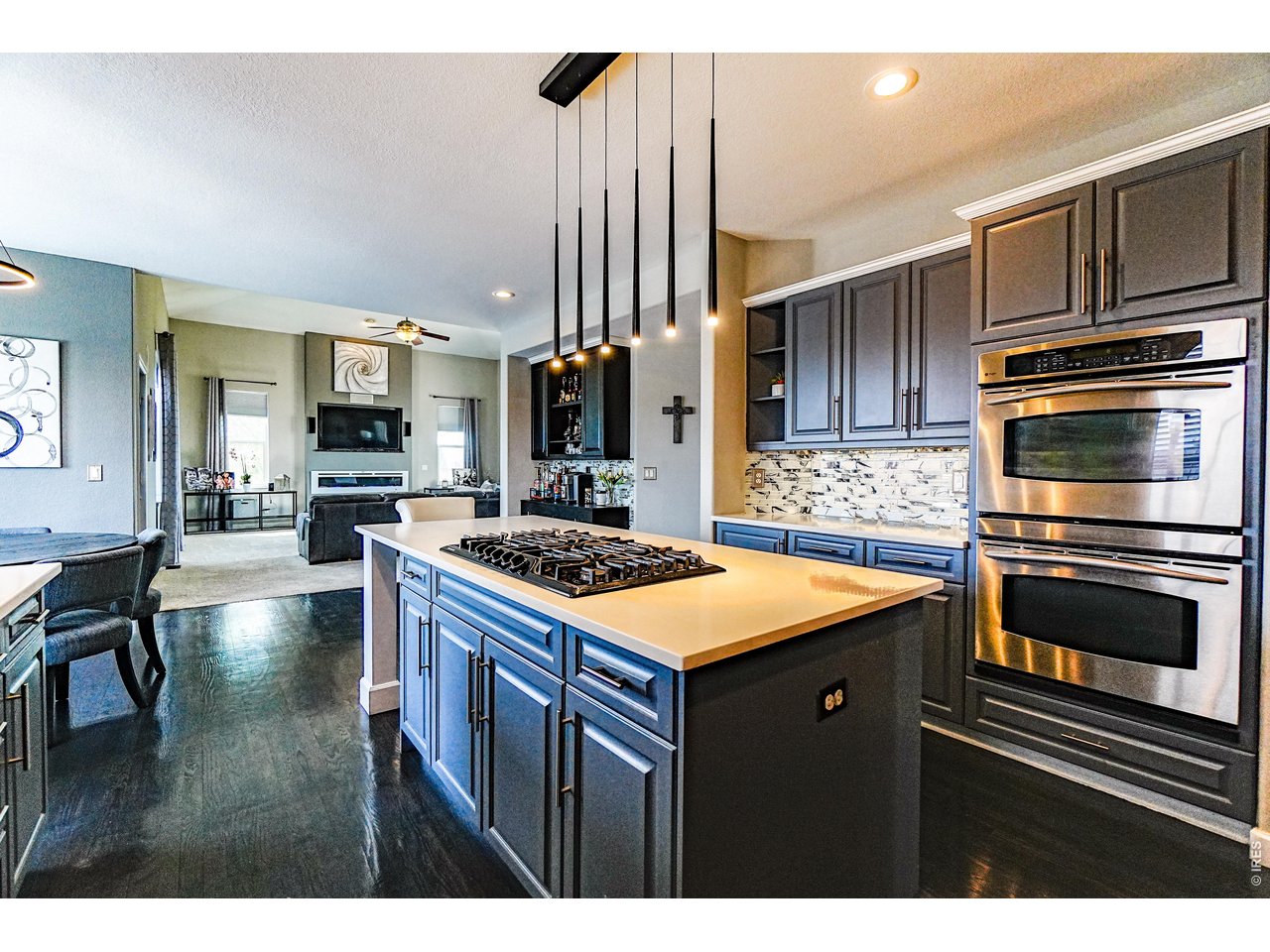 3938 Vale View Lane Mead, CO 80542 - Photo 6 of 49 a kitchen with stainless steel appliances granite countertop a stove a sink and a microwave