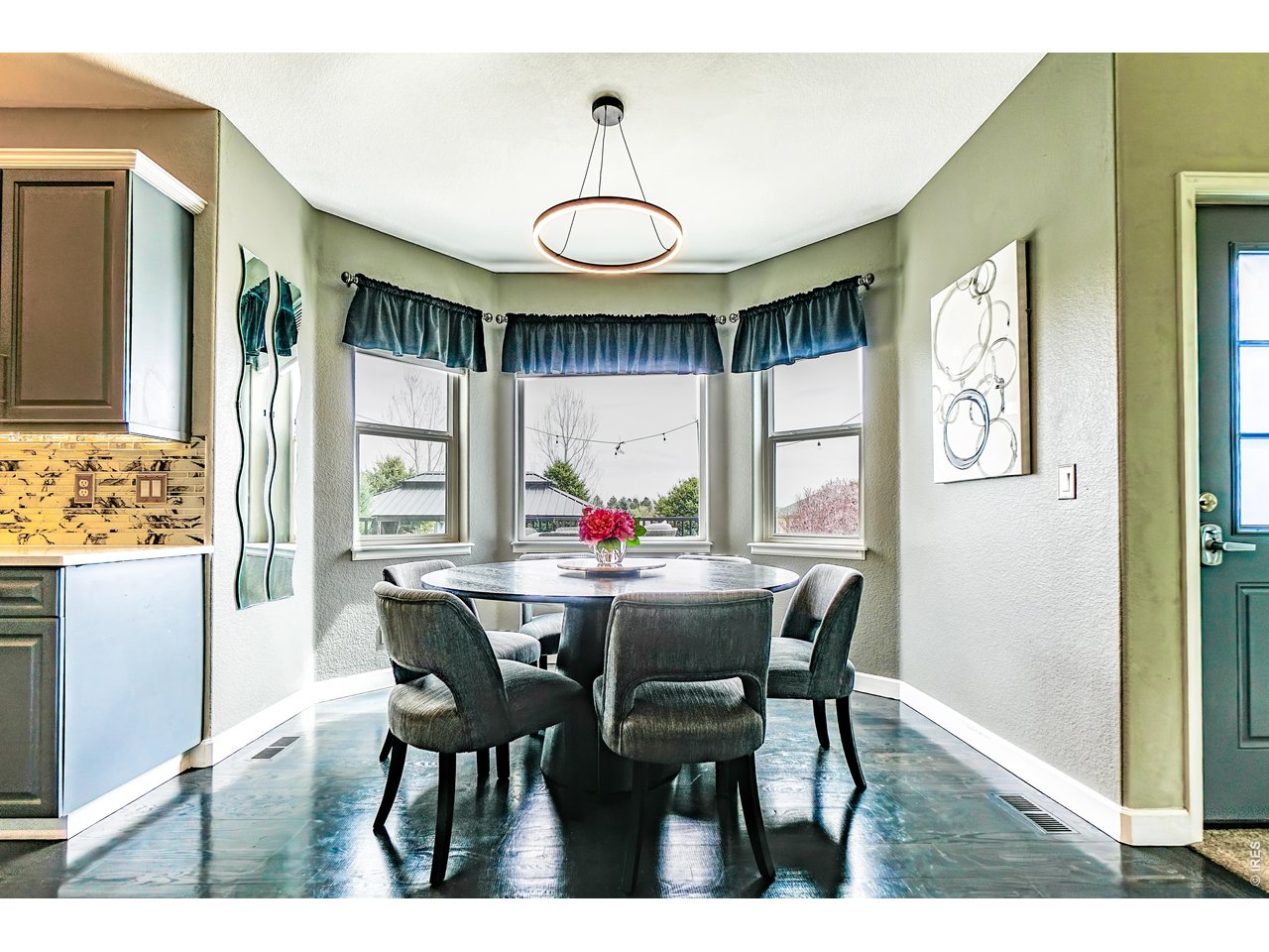 3938 Vale View Lane Mead, CO 80542 - Photo 9 of 49 a view of a dining room with furniture and window