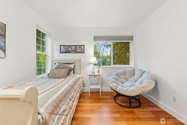 a bedroom with a bed and a couch