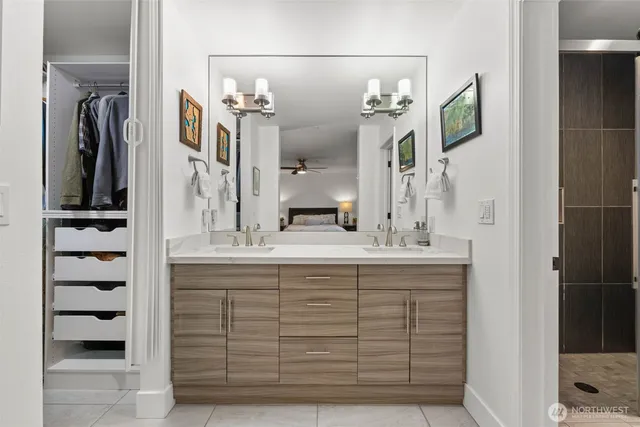 a bathroom with a sink vanity and a mirror