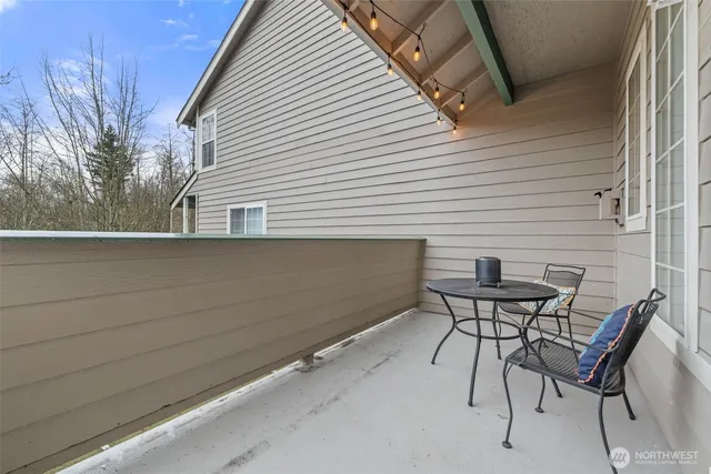 a view of backyard with seating area