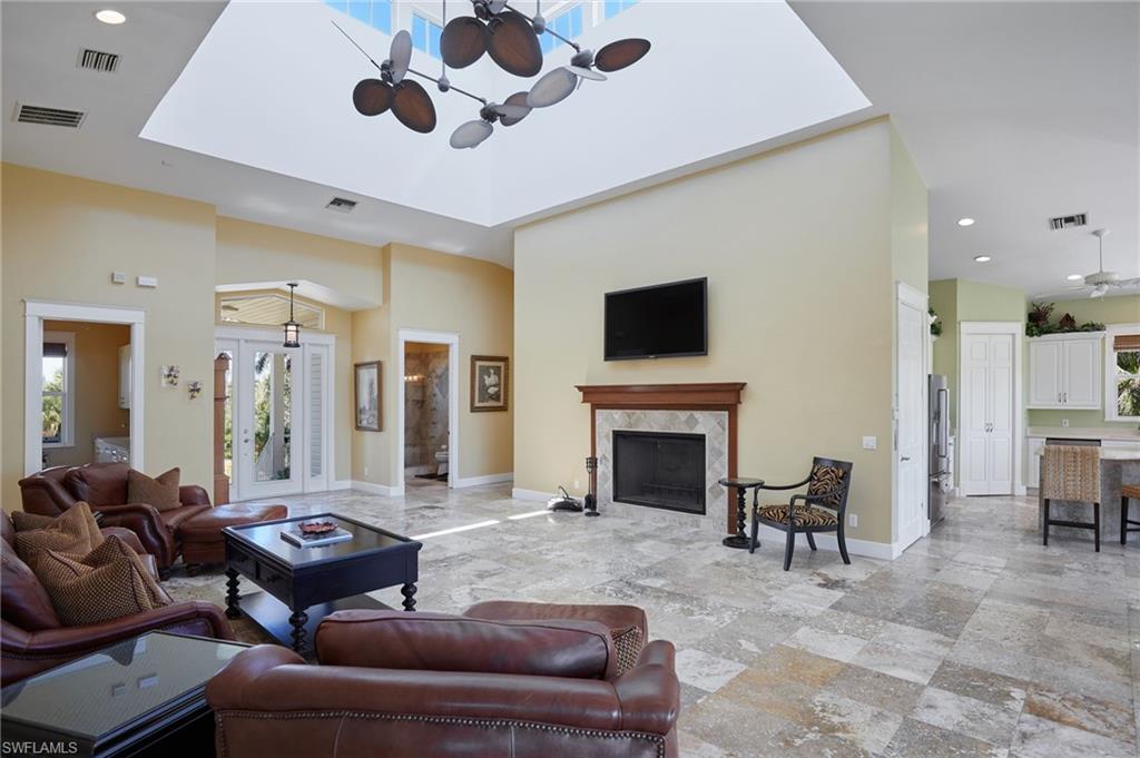 18481 Pioneer Road Fort Myers, FL 33908 - Photo 10 of 44 Living area with visible vents, a fireplace, and baseboards